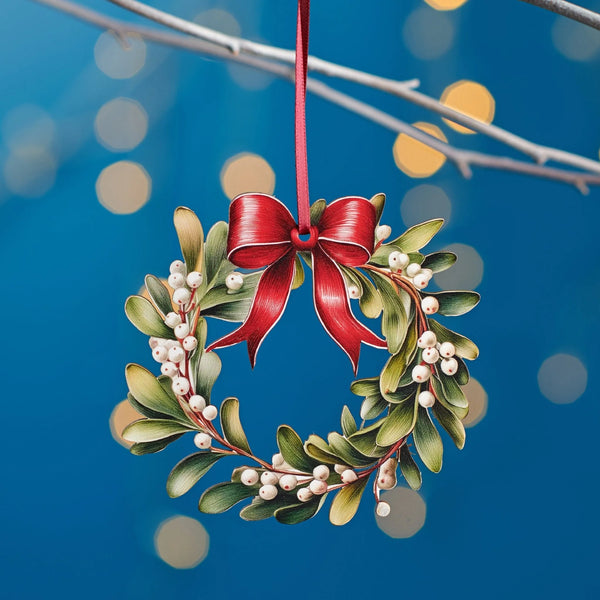 Decorative wreath with red bow hanging against a blue background